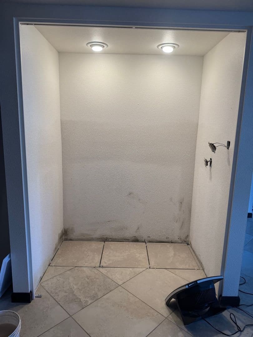 Wet bar area before restoration — water damage visible