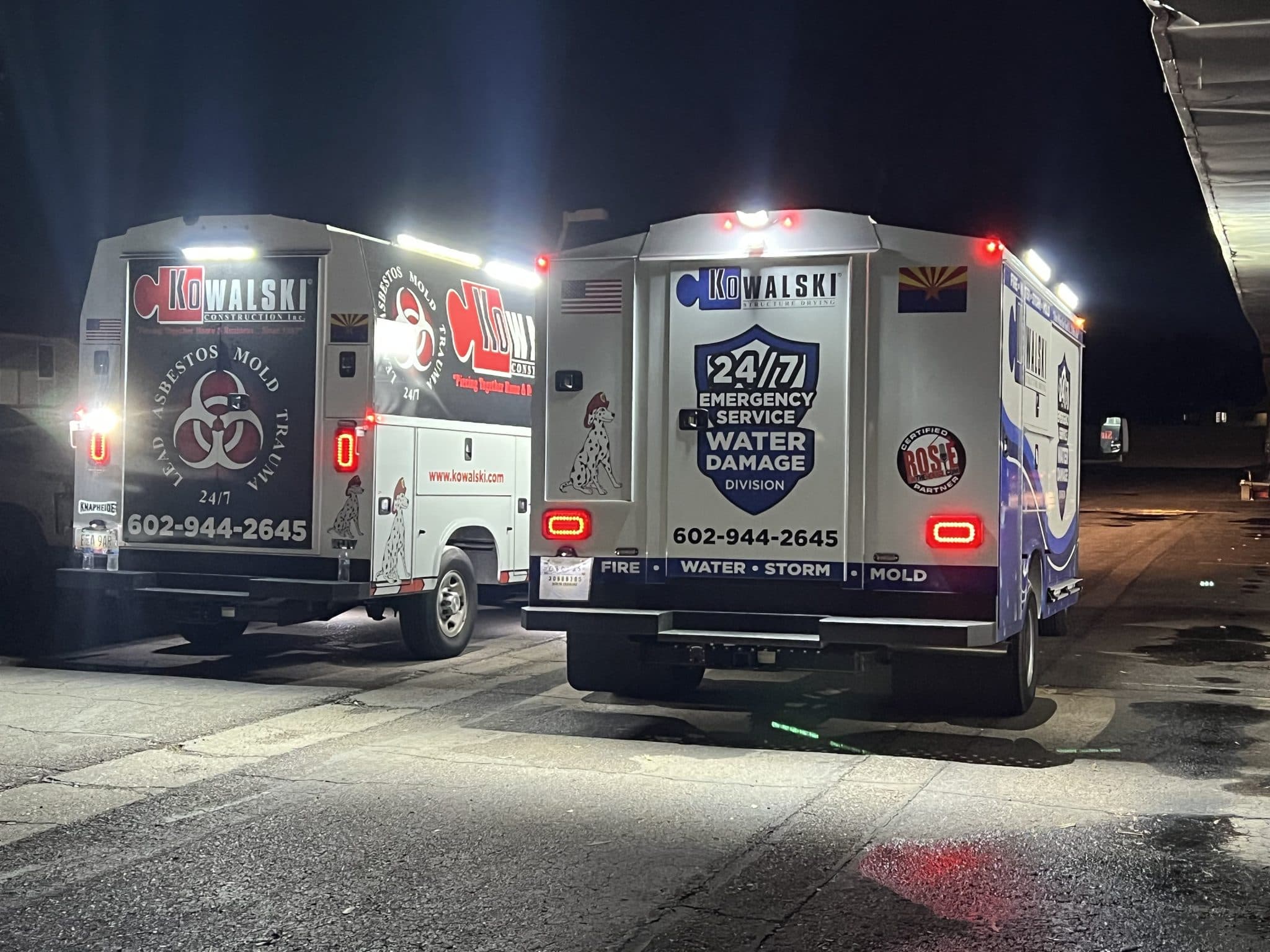Kowalski 24/7/365 emergency water damage and hazmat vans staged at night, ready for dispatch across Phoenix metro